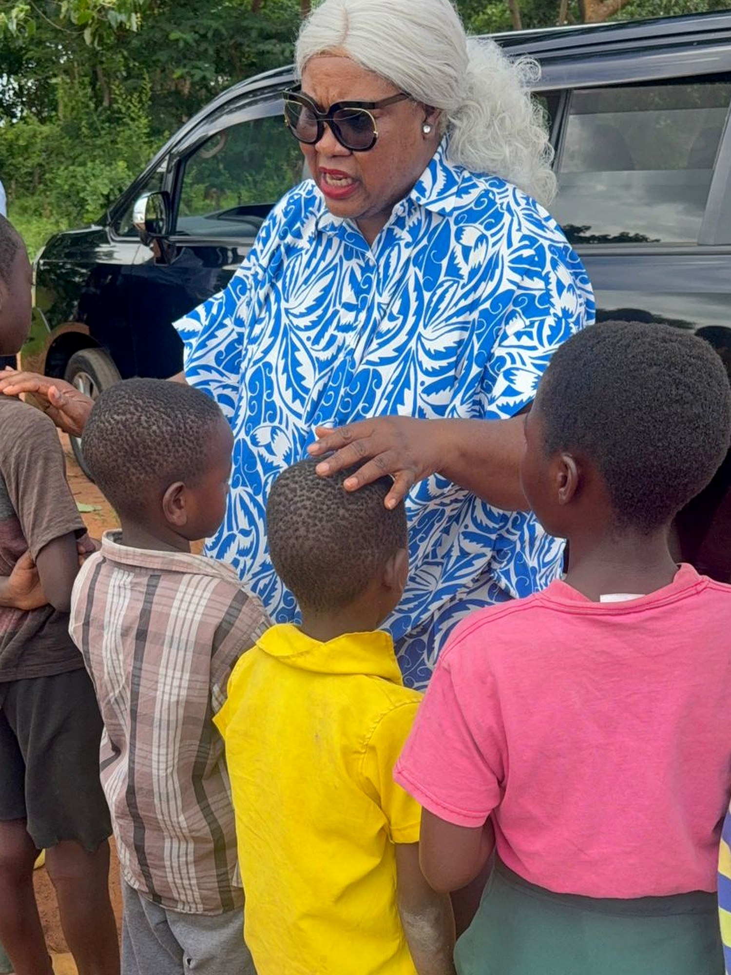 Evangelist Ebele Philips blessing children during a CharityFaith International outreach